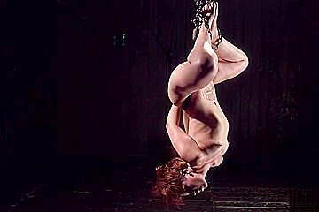 Chained And Suspended Redhead Whipped