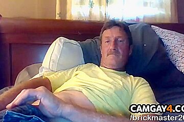 Mature Lying On His Bed