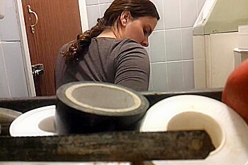 Unsuspecting Lady Sitting On Toilet Spied By