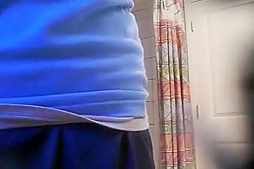 Tapes A Ponytailed Brunette Girl Taking A Shower